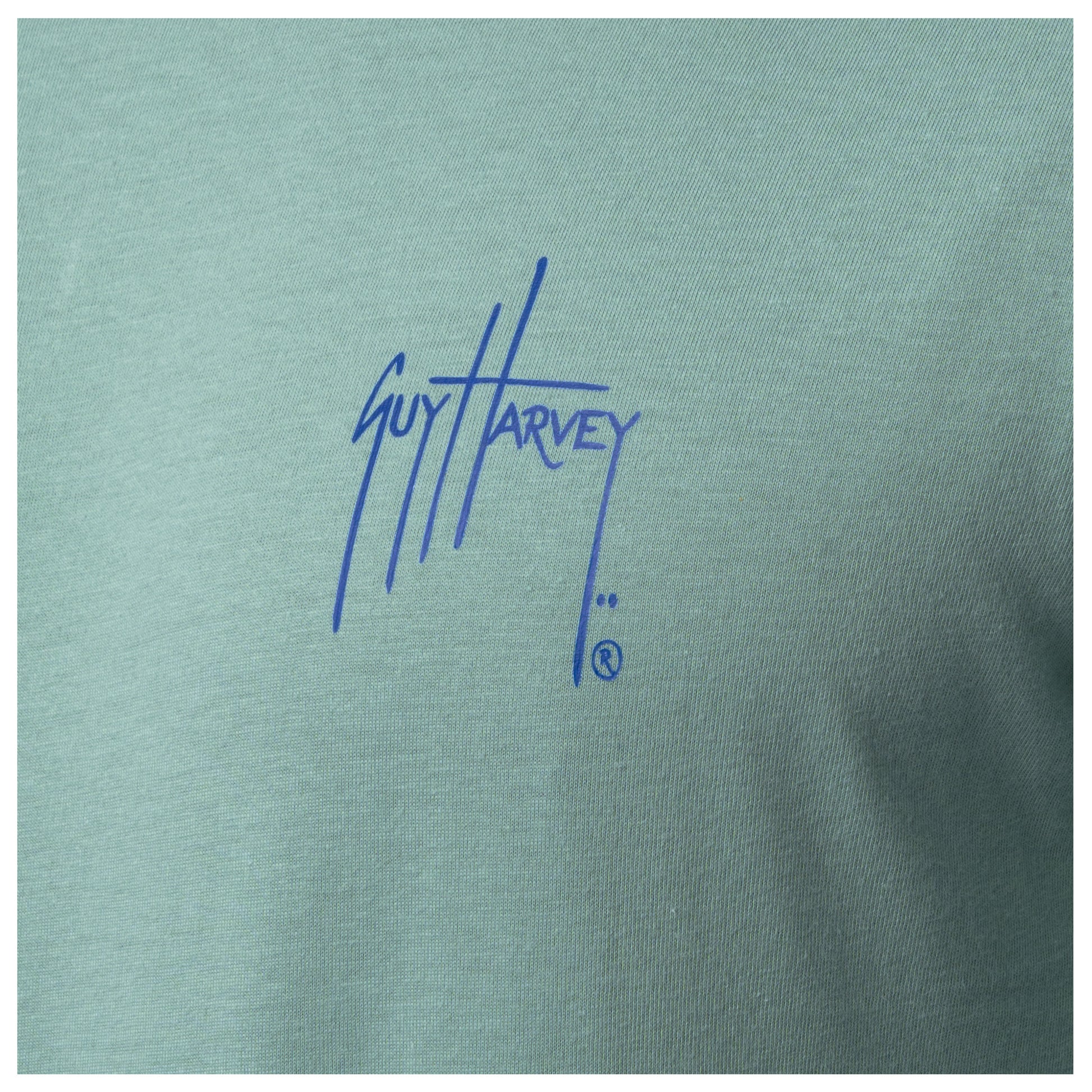Close-up of chest Guy Harvey signature logo on Men’s Saltwater Paradise Long Sleeve Tee