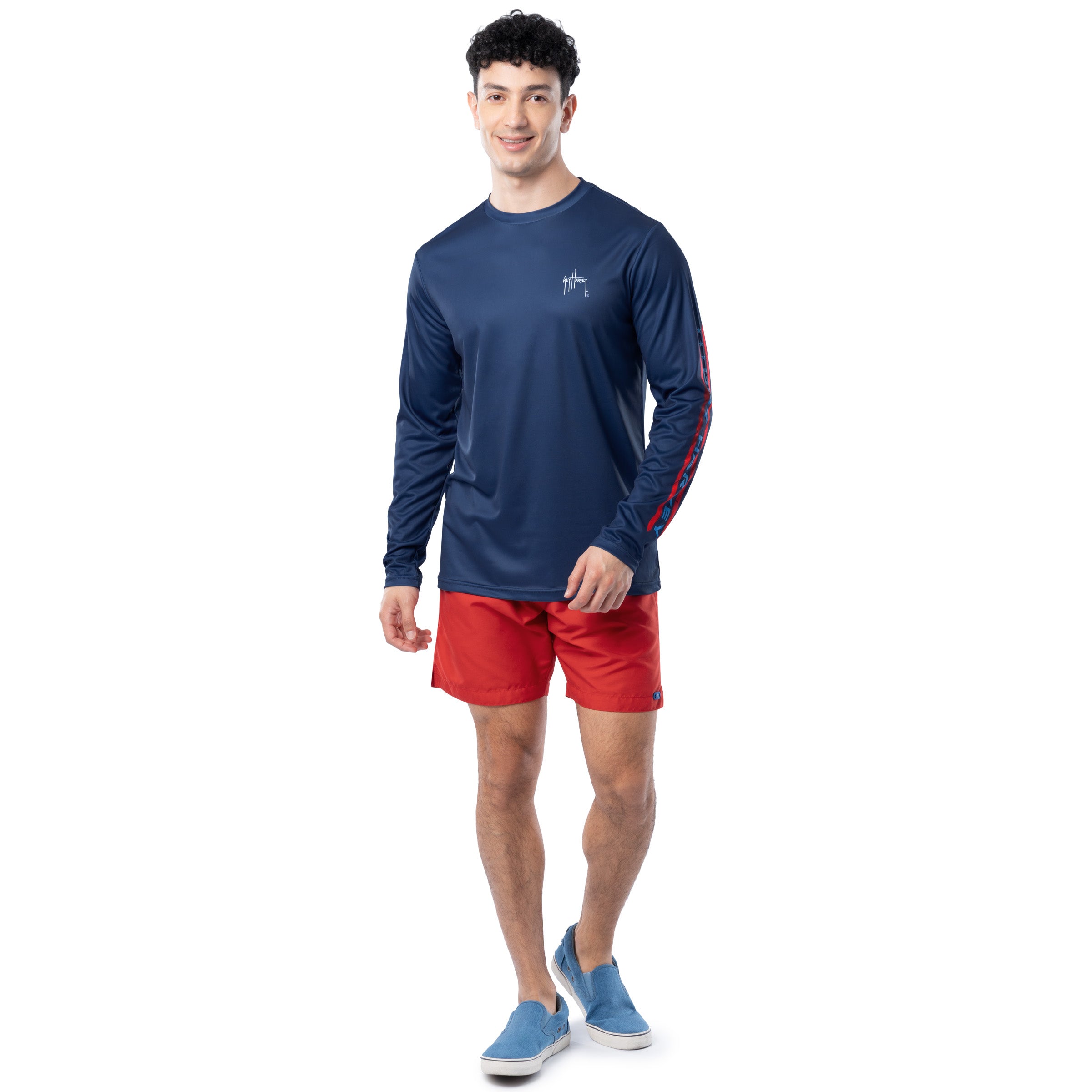 Lifestyle photo of model wearing Guy Harvey Men’s Stars and Stripes Performance Sun Protection Long Sleeve Top