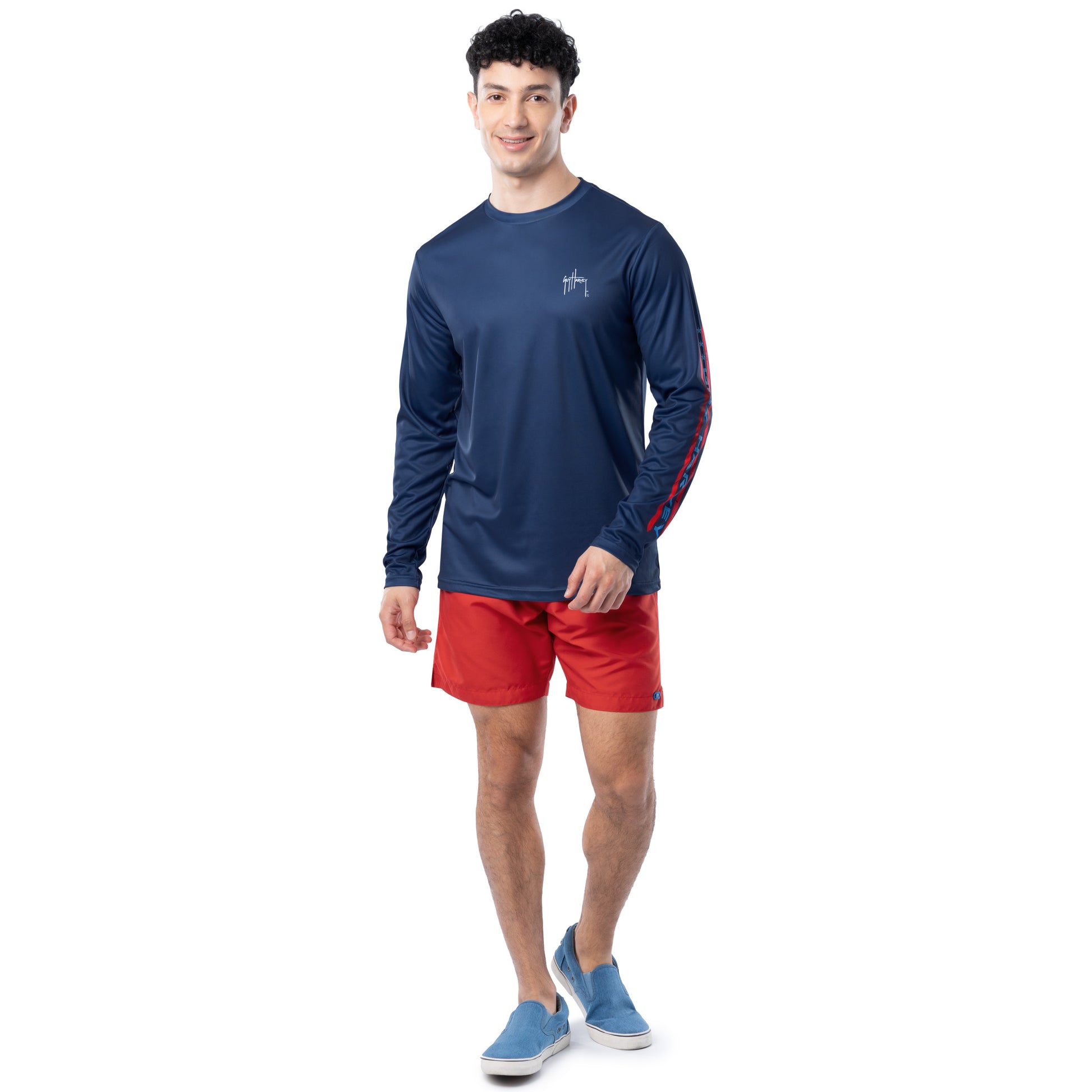 Lifestyle photo of model wearing Guy Harvey Men’s Stars and Stripes Performance Sun Protection Long Sleeve Top