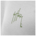 Close-up of chest Guy Harvey signature logo on Men’s Titan Bass Performance Long Sleeve Top