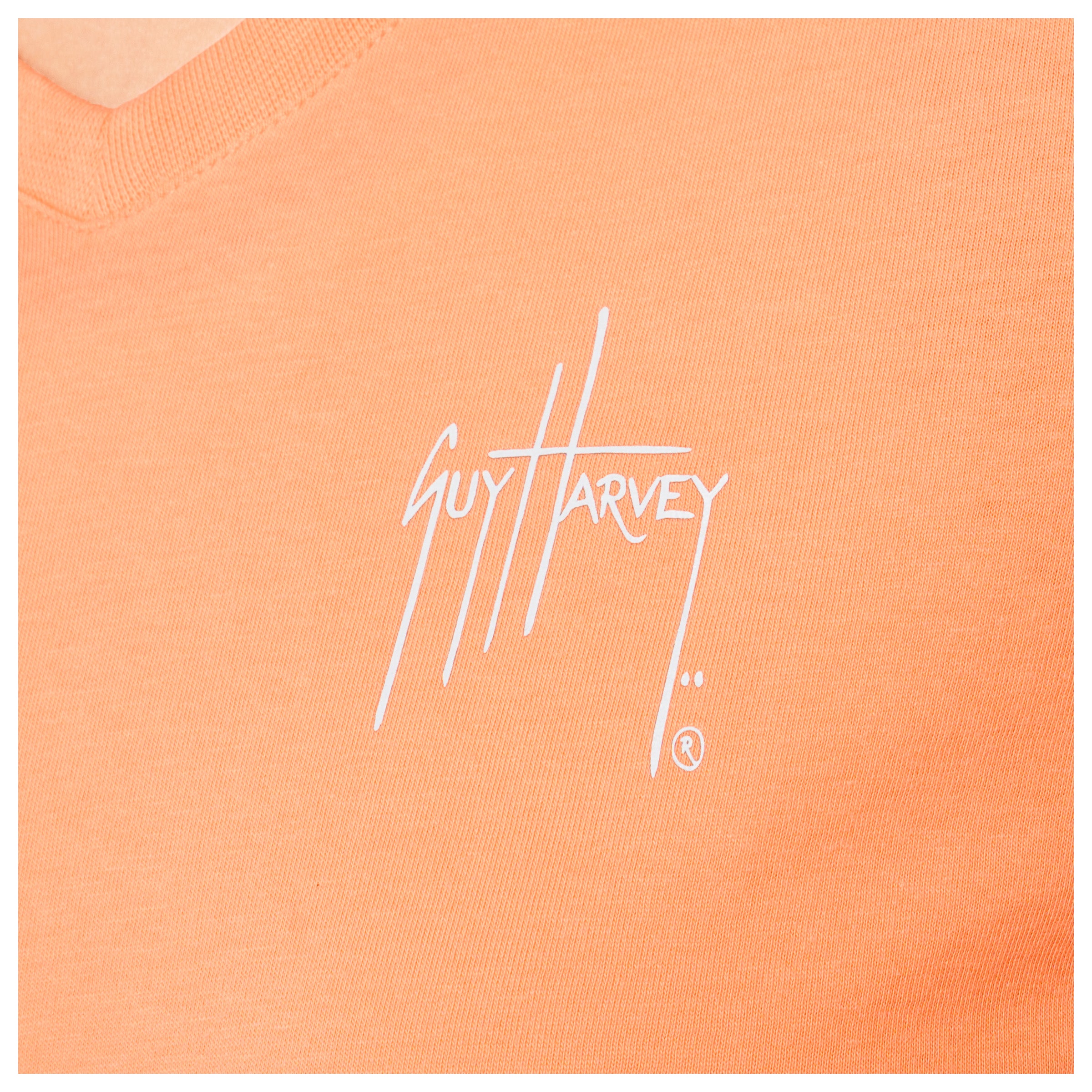 Close-up of left chest Guy Harvey signature logo on Women’s Circle Marlin V-Neck T-Shirt