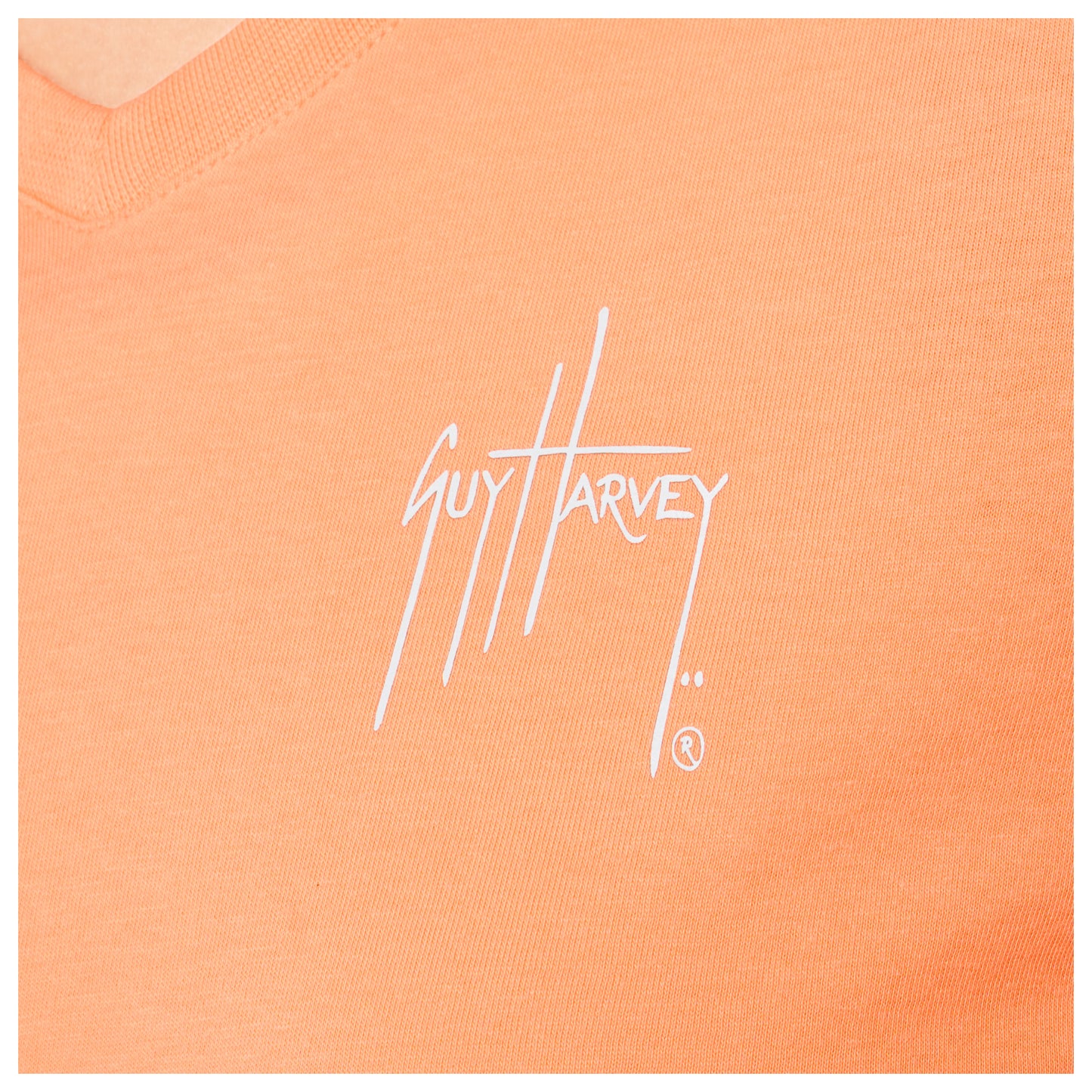 Close-up of left chest Guy Harvey signature logo on Women’s Circle Marlin V-Neck T-Shirt