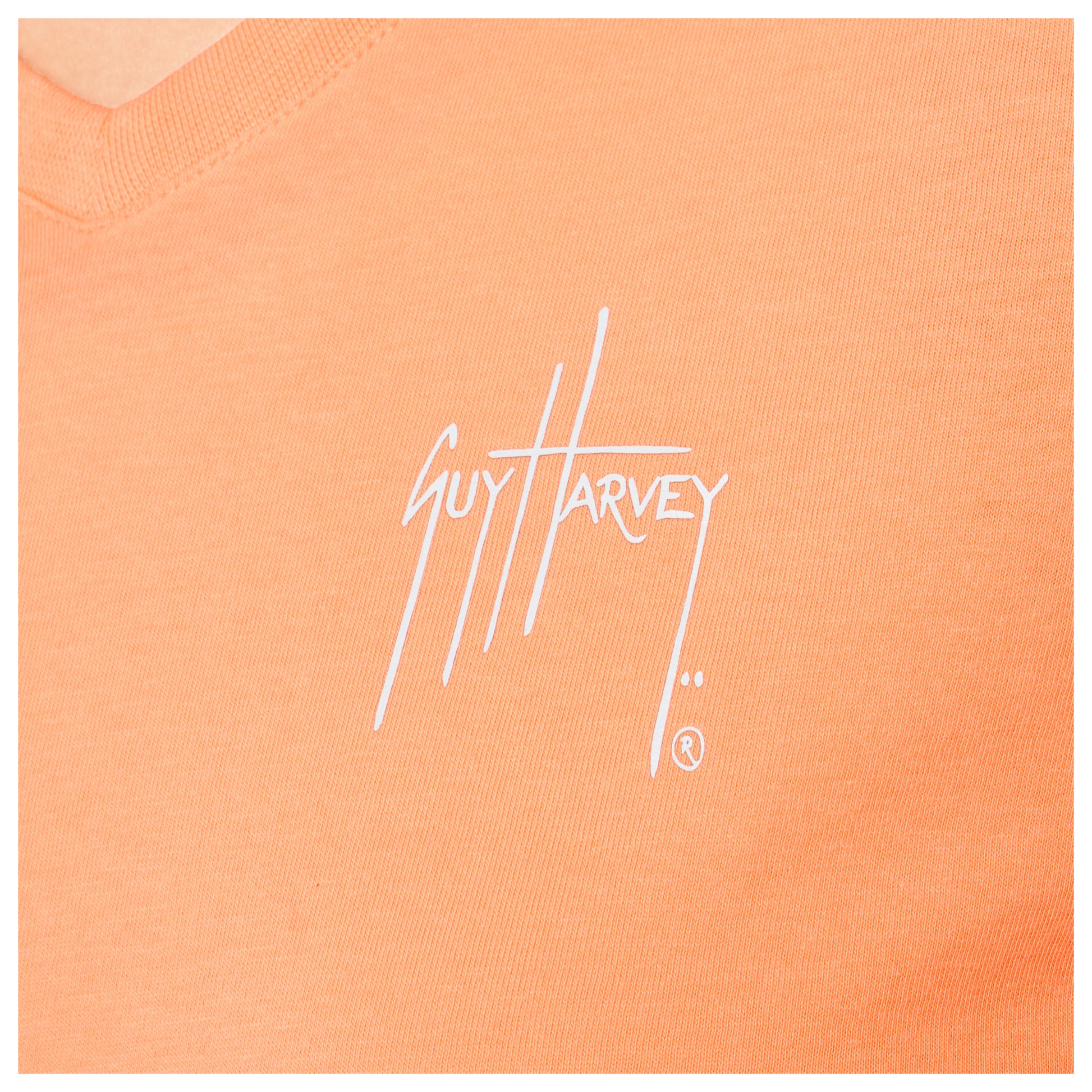 Close-up of left chest Guy Harvey signature logo on Women’s Circle Marlin V-Neck T-Shirt