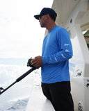 Man in a blue marlin air shirt with fishing rod on a boat