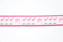 Guy Harvey Men’s Flamingo Leather Tab Belt with pink flamingo illustrations on white cotton webbing, brown leather tabs, pink trim, and brass buckle