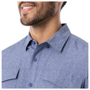 Close up on the neck of the shirt. It has small buttons to hold the neck in position.