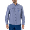 A man wearing a long sleeve blue heather textured performance fishing shirt with a collared neckline and double breast pockets, featuring Guy Harvey artwork on the chest.